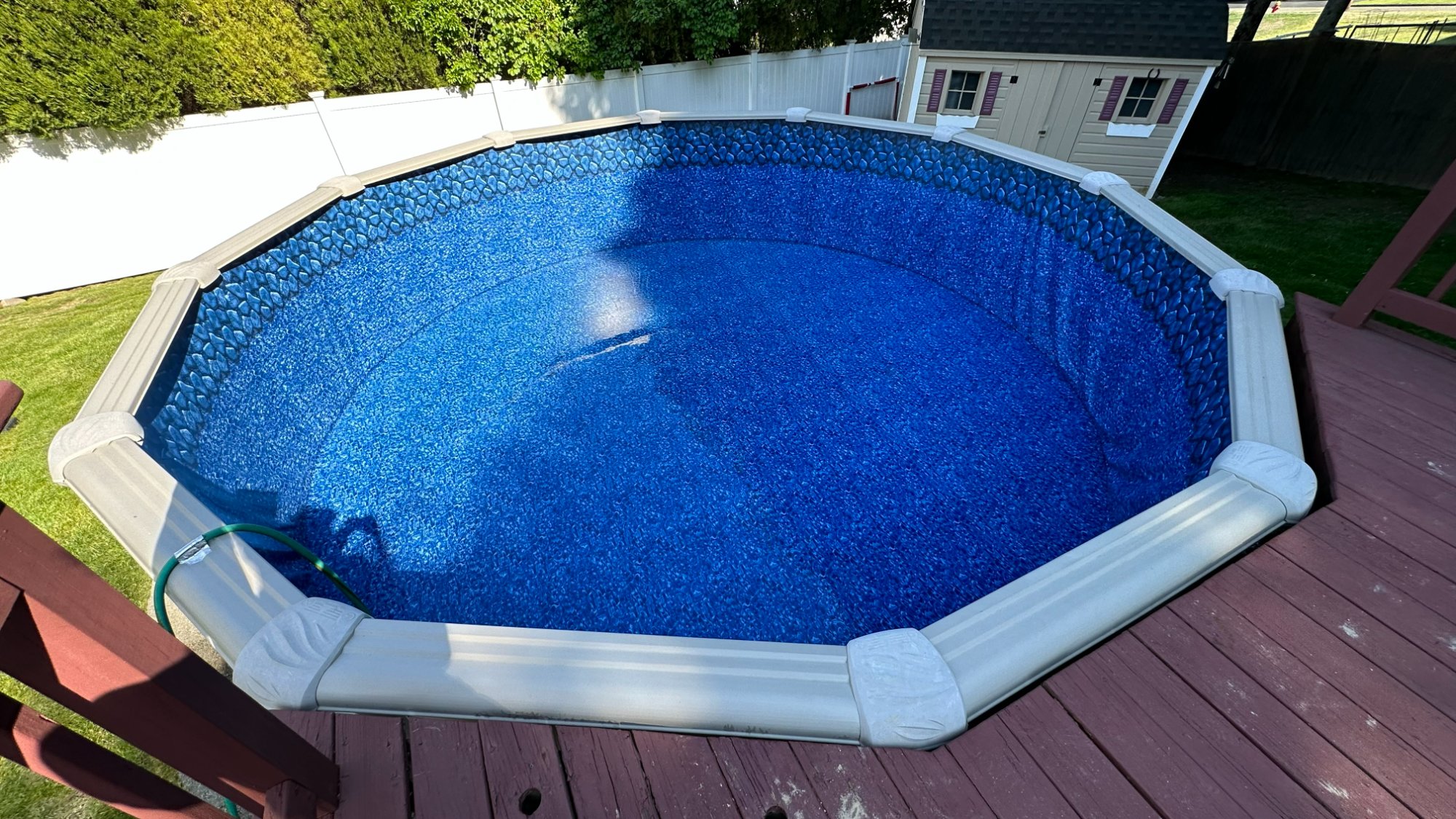 Above-ground pool after liner replacement — brand new blue vinyl liner installed by North Shore Pool Boys