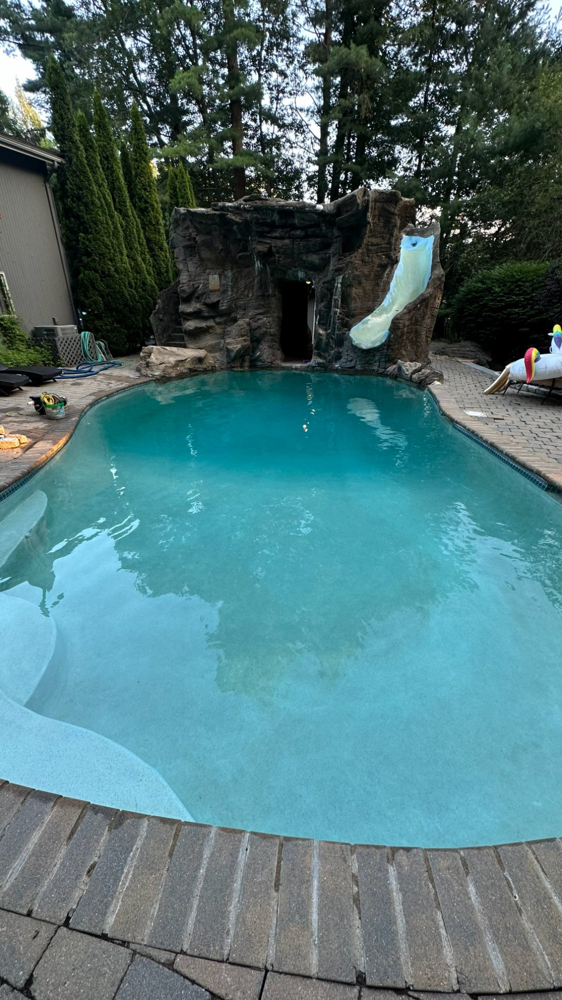 In-ground pool after maintenance visit — clear water and clean bottom by North Shore Pool Boys